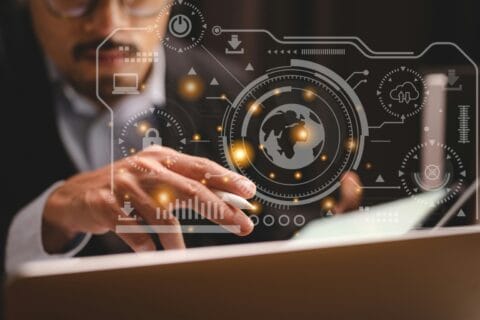 Businessman using tablet with futuristic digital interface overlay