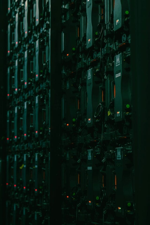 Rows of servers in dark data center