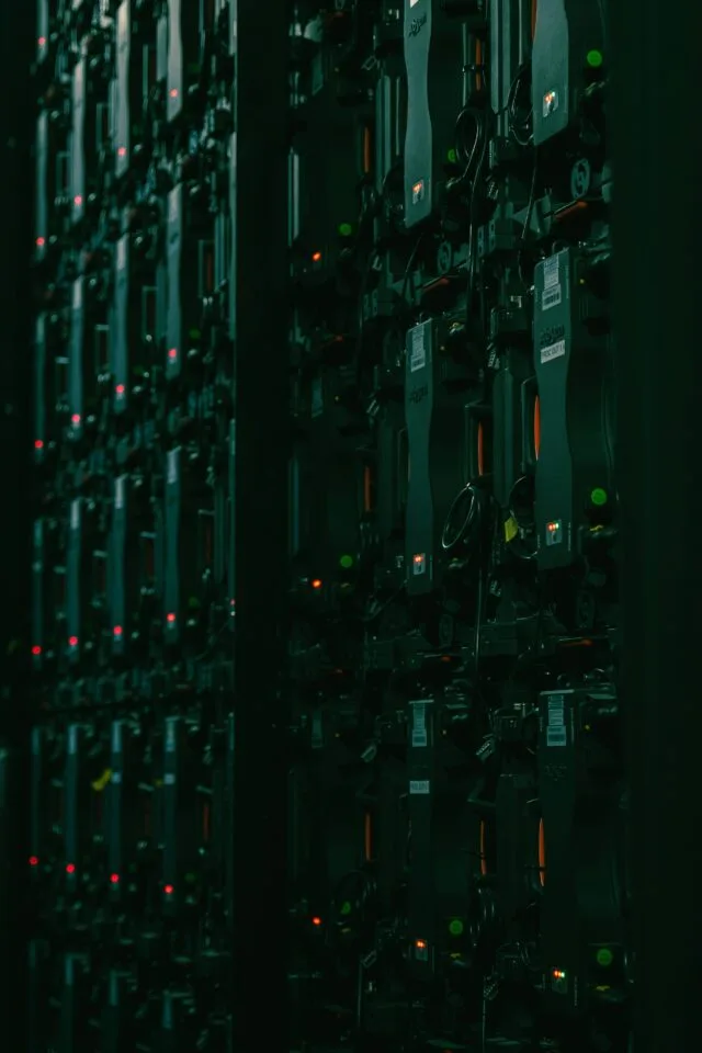 Rows of servers in dark data center